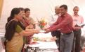 Shri Hari Shankar Sharma receiving the 2nd prize for Essay Competition by Dr. Girija Vyas, hon'bl Chairperson, NCW